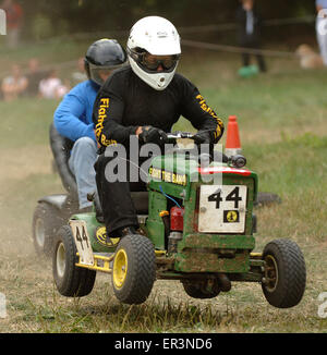 Lawnmower racing using specially tuned and adapted sit-on lawnmowers, racing around a grass circuit in Caldicot,Wales,UK.a sport Stock Photo