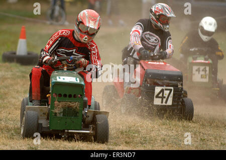 Lawnmower racing using specially tuned and adapted sit-on lawnmowers, racing around a grass circuit in Caldicot,Wales,UK.a sport Stock Photo