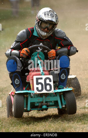 Lawnmower racing using specially tuned and adapted sit-on lawnmowers, racing around a grass circuit in Caldicot,Wales,UK.a sport Stock Photo