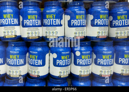 Jars of whey protein displayed in London health food shop Stock Photo