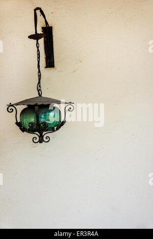 Elegant vintage green lamp on background of blurred library Stock Photo -  Alamy