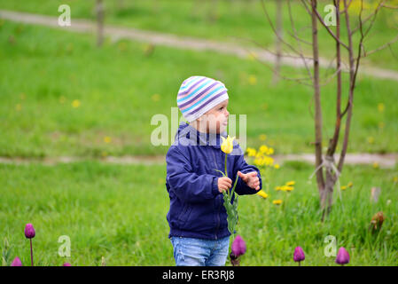 Two year old girl on a walk in the park Stock Photo