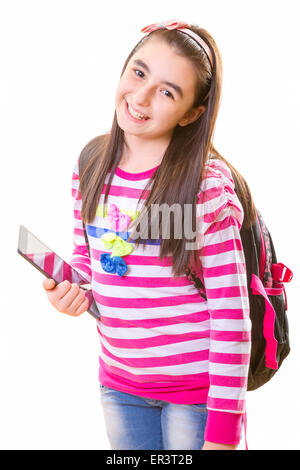 beautiful teenager girl in casual clothes with backpack holding digital tablet in her hand Stock Photo