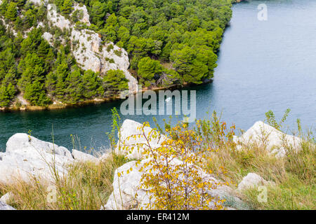 View over the bay of Skradin ending Krka river in Croatia: boat in canyon Stock Photo