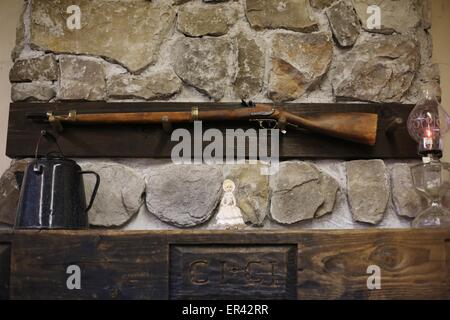 A gun above the hearth at the Laura Ingalls Wilder museum in Walnut ...