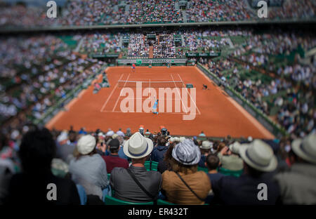 Paris, France. 26th May, 2015. Rafael Nadal of Spain serves the ball during the men's singles first round match against Quentin Halys of France at 2015 French Open tennis tournament at Roland Garros, in Paris, France on May 26, 2015. Nadal won 3-0. Credit:  Chen Xiaowei/Xinhua/Alamy Live News Stock Photo
