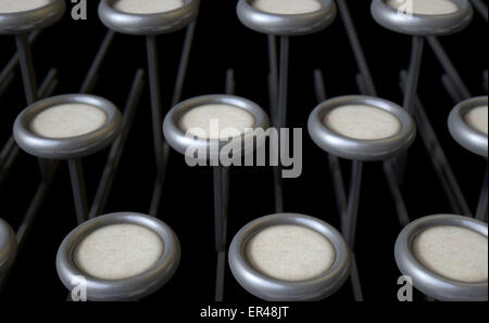 A concept view of an extreme close up of blank unmarked keys of a vintage typwriter on a dark background Stock Photo