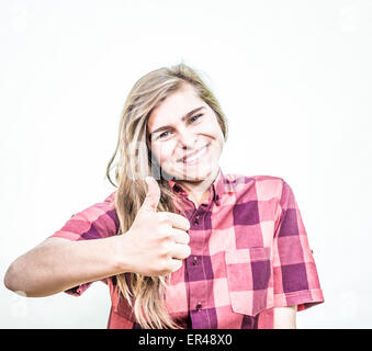 Teenage girl is showing thumbs up showing a nice, happy and supportive attitude. Stock Photo