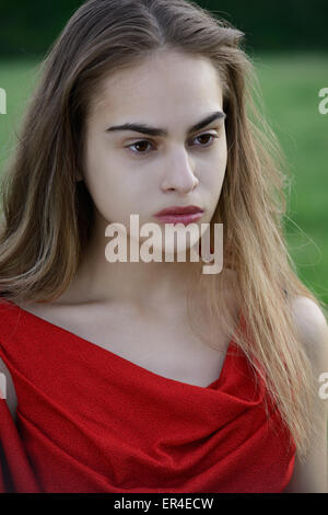 strong beauty, woman in red Stock Photo