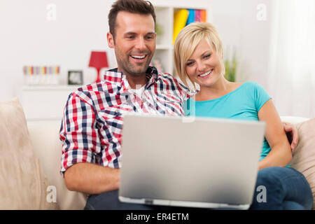Young couple using a laptop Stock Photo