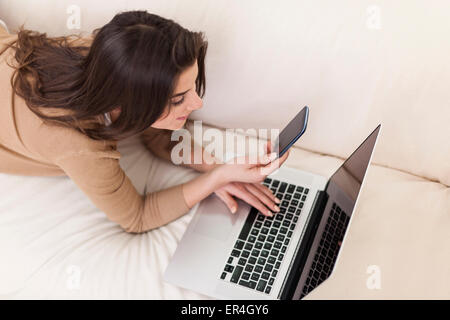 Beautiful woman relaxing on the sofa Stock Photo