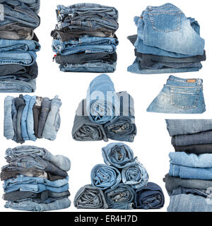Set of various stacked jeans isolated on white background Stock Photo