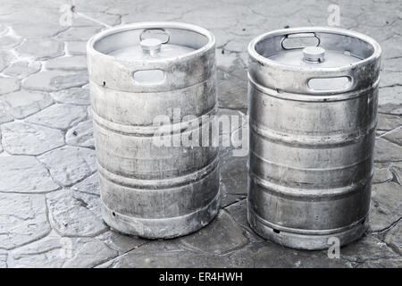 Used aluminum kegs, small barrels commonly used to store, transport, and serve beer Stock Photo