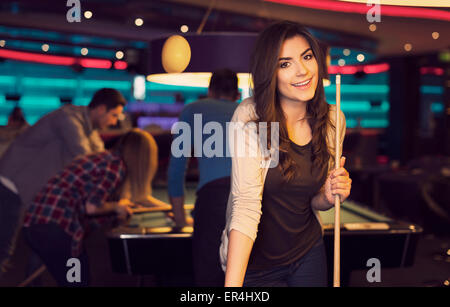 Premium Photo  Friends playing pool at billiard club and shooting