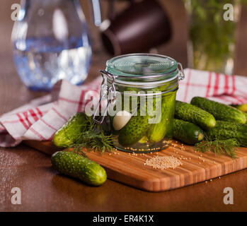 Pickled cucumbers in glass jar. Debica, Poland Stock Photo