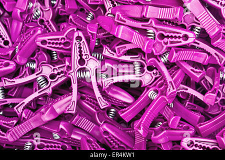 background of purple plastic clothespin Stock Photo
