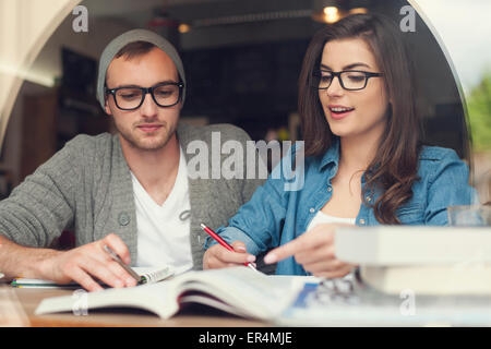 Hipster young couple studying together at cafe. Krakow, Poland Stock Photo