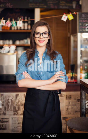 Portrait of nerdy waitress at work. Krakow, Poland Stock Photo