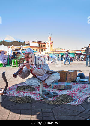 Snake Charmer in the 'Djeema el fnaa'  - The very busy Marrakech market square Stock Photo