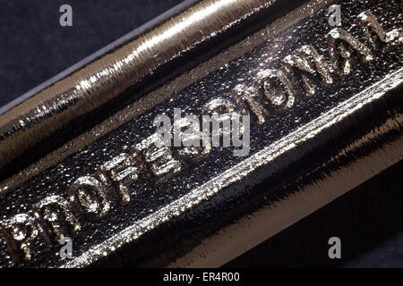 Written word on metal, part of industrial tool. Stock Photo