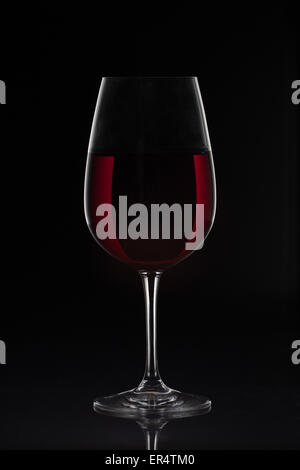 Red wine glass with wine on black background Stock Photo