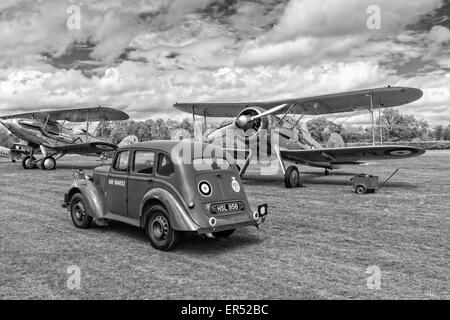 1938 Hillman Minx, Gloster Gladiator and Hawker Demon on the flightline at The Shuttleworth Collection, Old Warden Stock Photo