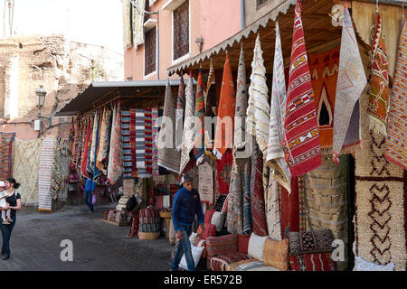 Street market selling rugs in the Marrakesh Medina Stock Photo