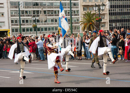 Athens, Greece, - April 05, 2015: A solemn military parade of soldiers  wearing traditional  uniforms going down the streets of  Stock Photo