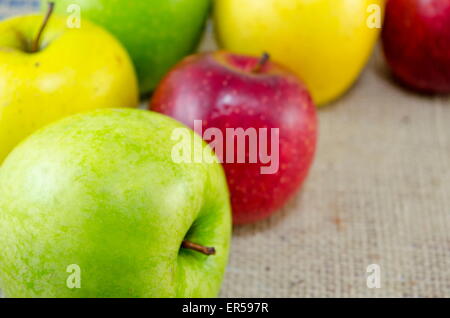 Yellow red and green apples arranged together Stock Photo
