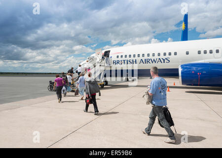 Passengers boarding British Airways (Comair) Boeing 737 at Hosea Kutako International Airport, Windhoek, Republic of Namibia Stock Photo