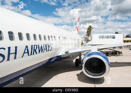 Loading disabled passenger on British Airways (Comair) Boeing 737 at Hosea Kutako International Airport, Windhoek, Namibia Stock Photo