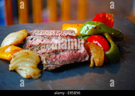 Grilled steak sliced with vegetables Stock Photo