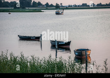 Sunset and fishing boats on the island of Ummanz, Island of Ruegen, Mecklenburg-Western Pomerania, Germany Stock Photo