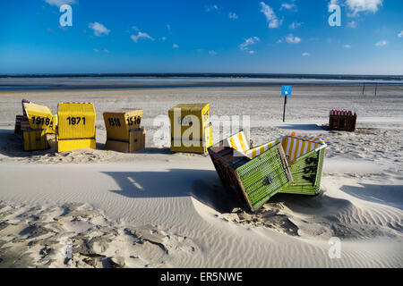 Beach chairs on the beach after a stormy night, Langeoog Island, North Sea, East Frisian Islands, East Frisia, Lower Saxony, Ger Stock Photo