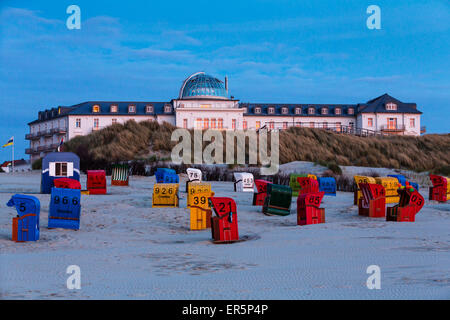 Spa Hotel at dusk, beach chairs, Juist Island, Nationalpark, North Sea, East Frisian Islands, East Frisia, Lower Saxony, Germany Stock Photo