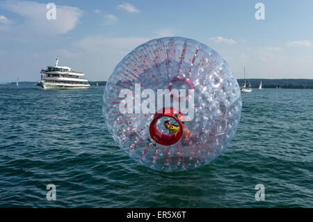 Fun Ball on Lake Constance in Ueberlingen, Ferry in the background, Baden-Wuerttemberg, Germany, Europe Stock Photo