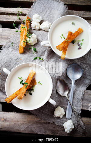 Creamy cauliflower soup with toasted bread Stock Photo