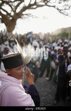 Group of believers around a meeting tree, priest with horsehair frond in foreground, Axum, Tigray Region, Ethiopia Stock Photo