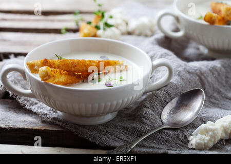 Creamy cauliflower soup with toasted bread Stock Photo