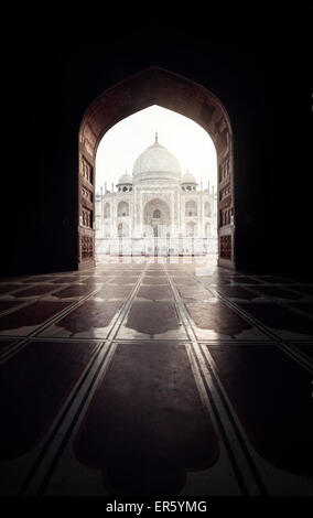 Taj Mahal view in black arch silhouette from the mosque in Agra, Uttar Pradesh, India Stock Photo