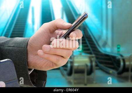 man holds phone in hand Stock Photo