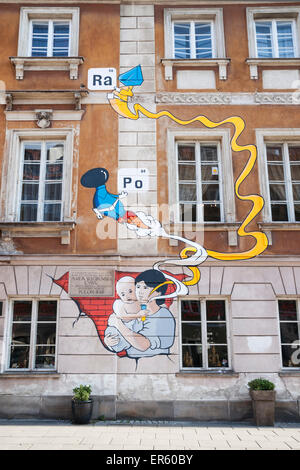 Mural on birthplace of Madame Marie Curie Skłodowska, shows Maria holding a test tube and vapors representing the elements she d Stock Photo