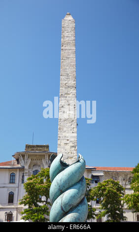 The optic effect when the Serpent Column enfolds the Walled Obelisk on the Hippodrome of Constantinople, now Sultan Ahmet Square Stock Photo