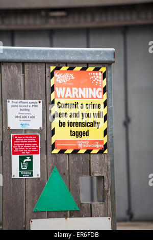 Warning Commit a crime here and you will be forensically tagged - Wessex Water sign at Swanage Stock Photo