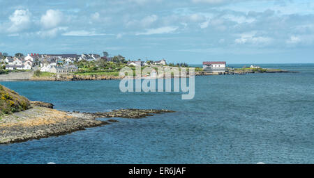 View towards Moelfre, Anglesey, North Wales, UK with new lifeboat house. Stock Photo