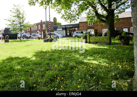 A village green with maypole and stocks in the middle of England Stock Photo