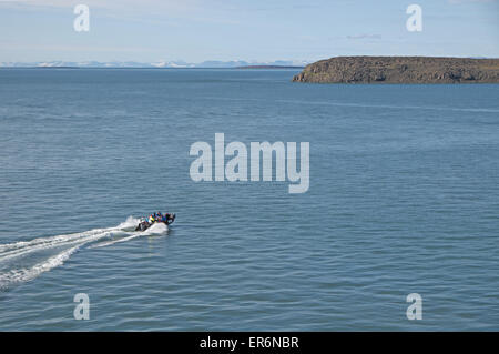 Tourists going ashore in one of MV Fram's Zodiac boats, Sundneset, south west Barentsoya, Svalbard. Stock Photo