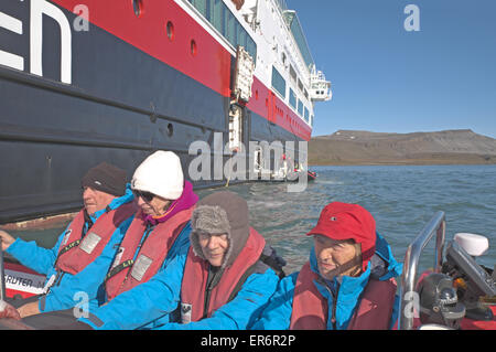 Tourists going ashore in one of MV Fram's Zodiac boats, Sundneset, south west Barentsoya, Svalbard. Stock Photo