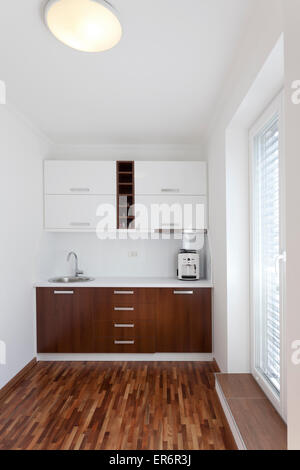 small white kitchen in apartment Stock Photo