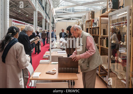 London, UK. 28 May 2015. Literary fans and collectors gather for the 58th London International Antiquarian Book Fair at Kensington Olympia. This major three-day event is one of the largest and most prestigious antiquarian book fairs in the world, showcasing rare, unique and unusual items from 180 leading UK and international dealers. Credit:  Stephen Chung / Alamy Live News Stock Photo